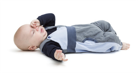 tired baby on floor isolated on white