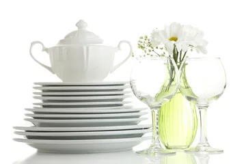 Fototapete Fertige gerichte Stack of white ceramic dishes and flowers, isolated on white