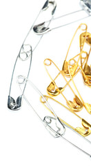 Safety pins isolated on white