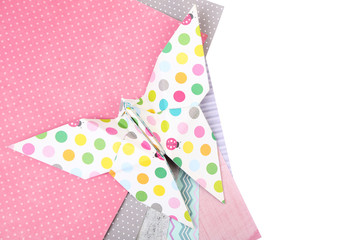 Origami butterfly and color papers isolated on white