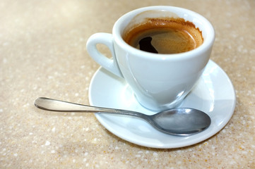 Cup of coffee on table in cafe