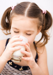 Little girl with a glass of milk