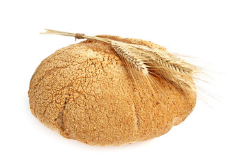 Bread and stalks of wheat on a white background