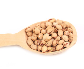 Wooden spoon with pistachios