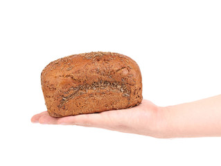 hand holding a  black bread
