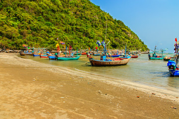 Fototapeta na wymiar Fishing boats park on the beach