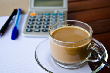 Coffee cup and office supplies