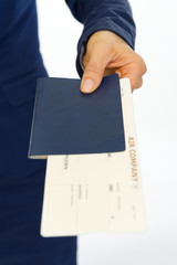 Closeup on business woman giving passport and ticket