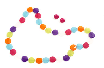 Close up with a necklace made from colorful pearls isolated