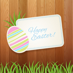 Easter background with greeting card and fence.