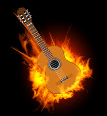 Acoustic guitar in fire flame