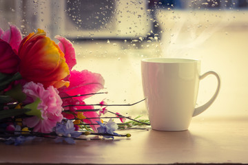 Coffee cup beside window