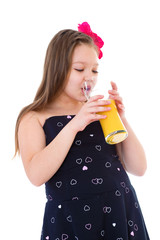 Young girl with glass of orange juice.