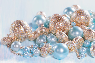 Blue beads on a wooden background closeup