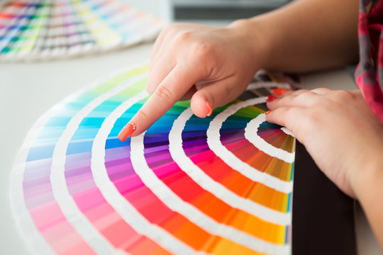Graphic designer working with pantone palette