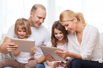 family and two kids with tablet pc computers