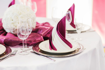 Elegant table set in soft creme for wedding or event party.