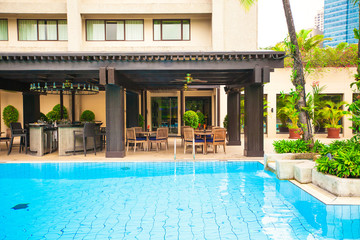 Beautiful view of luxury hotel with an outdoor pool and cafe