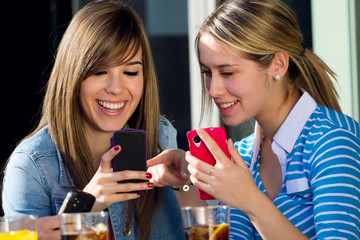 Friends having fun with smartphones