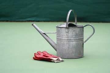 watering can and work gloves