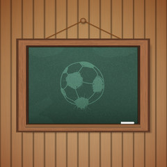 Realistic blackboard on wooden background drawing a soccer game