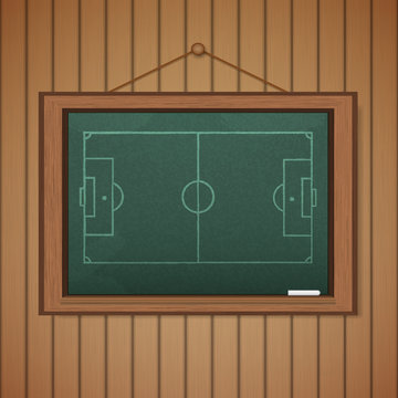 Realistic blackboard on wooden background drawing a Stadium socc