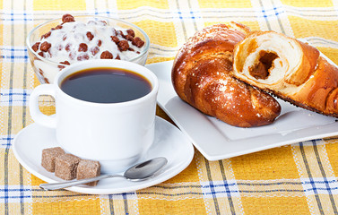 cup of coffee, fresh croissants and muesli