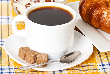 cup of coffee, fresh croissants and muesli