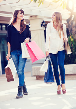 Beautiful girls with shopping bags