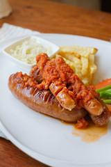 sausage platter with fried potato and vegetable
