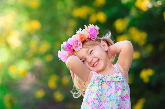 Happy Smiling Child With Flower At Summer Day Outdoor