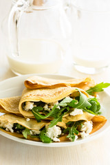 Arugula salad and cheese crepes