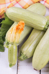 Fresh marrow on wooden table