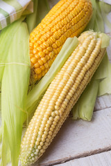 Fresh corn on wooden background