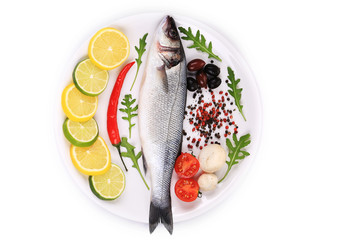 Seabass on plate with citrus and pepper.