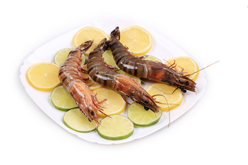 Shrimp lemon and lime on plate.