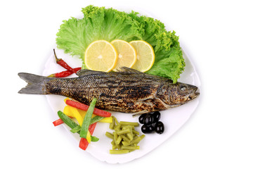 Grilled seabass on plate.