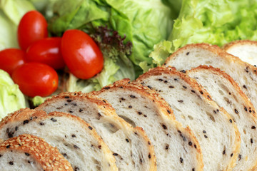 bread sprinkled with sesame -  vegetable green salad