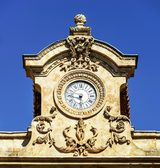Old clock on top of the house