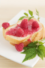 Fresh bread with raspberry jam