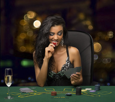 brunette girl in the casino playing poker