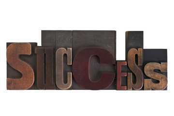 success, word written in vintage printing blocks