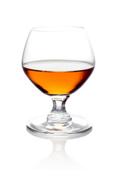 Single glass of cognac isolated on white