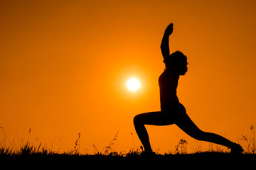 Silhouette woman with standing position yoga.