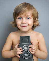 boy with an old camera