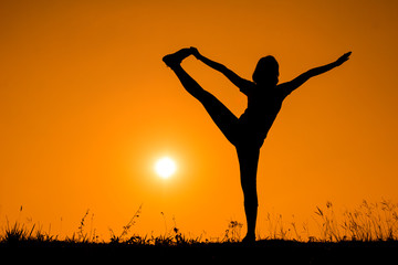 Silhouette woman with standing position yoga.