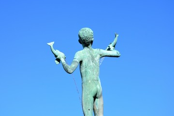 Statue of boy with fish