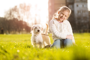 Little girl with her puppy dog