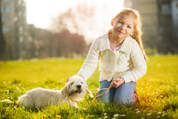 Little girl with her puppy dog