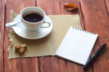 Cup Of Coffee and Open notebook